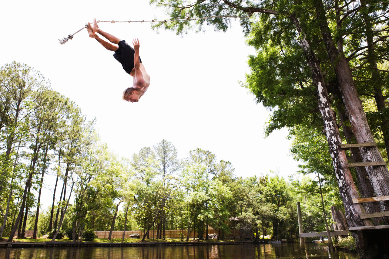 iStock man jumping into water